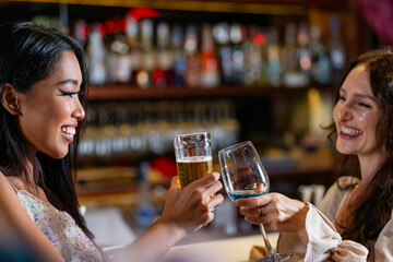 Two female friends enjoy a deep conversation over a glass of wine at a party or bar A concept for friendship social life and a girls night out