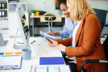 Female discussing new project with male colleague. Young woman talking