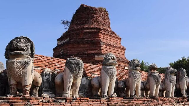 Ruins of Bell Shaped Pagoda Called Chedi Surrounded by 52 Lion Statues of Wat Thammikarat Buddhist Temple, Ayutthaya Historical Park, Thailand Footage