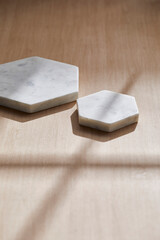 Light and Shadow on Wooden Texture with Modern Objects. Minimal Home Decor Scene with Ceramic Trays.