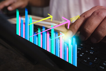 Business analysis plan 2026. Businessman working on laptop computer analyzing finance sale data and economic growth graph chart and financial report, business and technology concept, Strategy and goal