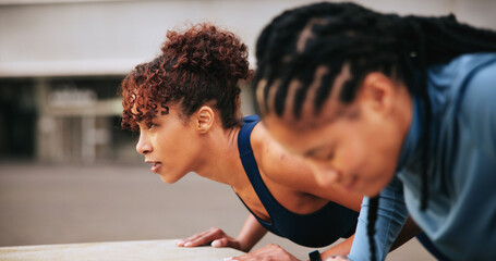 Fitness, warm up and women in city with workout or training for wellness, health or activity. Sports, push up and female athletes stretching body for exercise together in urban town for weightloss.