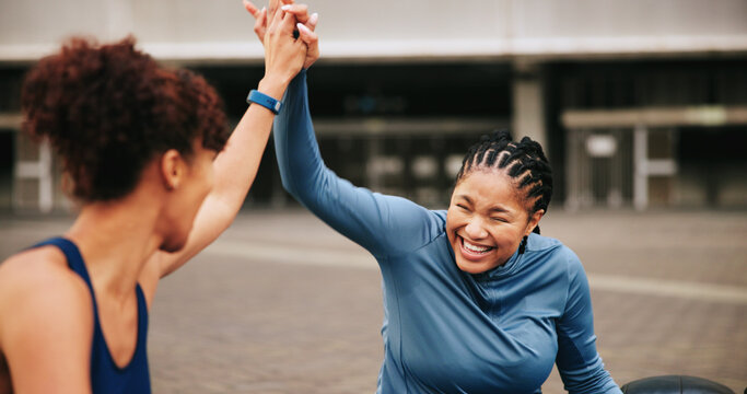 Fitness, exercise and friends with high five in city for workout success, teamwork or achievement. Athlete, women and happy with celebration outdoor for wellness goals, training progress and support - Powered by Adobe