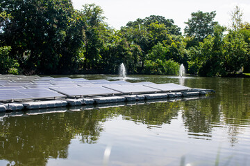 Selective focus to solar power station. Solar photovoltaic power station on water. Solar panels or...