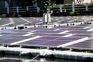 Selective focus to solar power station. Solar photovoltaic power station on water. Solar panels or...