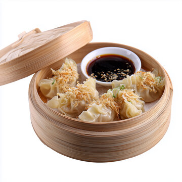 Steamed dumplings (Kanom Jeeb Thai) with garlic topping and soy dip