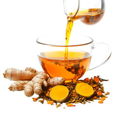 Golden turmeric tea being poured, showcasing its vibrant color and health benefits