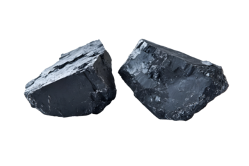 Two lumps of coal isolated on a black background, symbol of energy and minerals
