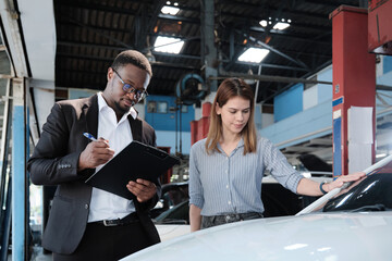 Warranty service business, White female client inspections sign declarations and contract from...