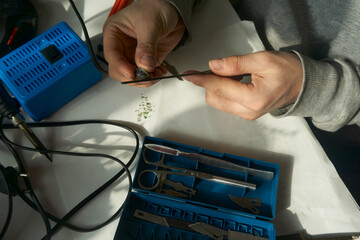 jeweler with a piece in his hands