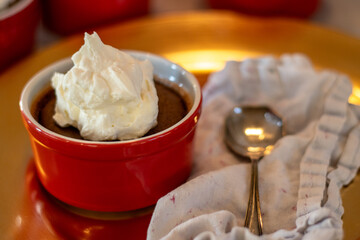 Chocolate cheesecake with whipped cream and linen napkin