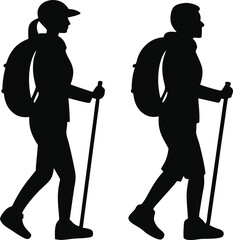 Silhouettes of a man and woman hiking with backpacks and walking sticks