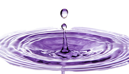Captivating purple water drop impact creates mesmerizing circular ripple effect