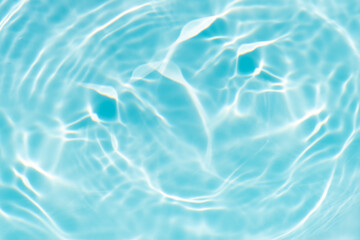 Blue water with ripples on the surface. Defocus blurred transparent blue colored clear calm water...