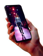A smartphone held in someone's hand showing a model doing a ramp walk on the screen, isolated on a white background — symbolizing fashion in the digital era.

