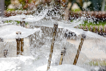 A fountain with water shooting out of it