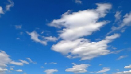 Blue sky cloud view, clear skies with scattered white clouds in sunlight perfect for nature backgrounds travel videos sky themed content and uplifting outdoor atmosphere