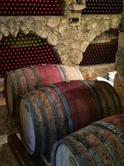 wine cellar. a place for storing and maturing wines. wooden barrels for aging wine, in the...