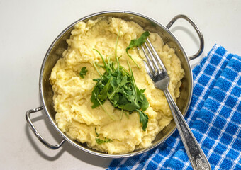 mash potatoes in a pan