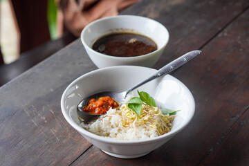 Rawon, East Java, Indonesia, captured on July 4, 2025. Traditional beef soup with rich black broth made from keluak nuts, served with rice, bean sprouts, and salted egg for a bold and aromatic flavor.
