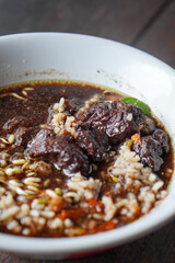 Rawon, East Java, Indonesia, captured on July 4, 2025. Traditional beef soup with rich black broth made from keluak nuts, served with rice, bean sprouts, and salted egg for a bold and aromatic flavor.