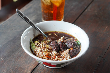 Rawon, East Java, Indonesia, captured on July 4, 2025. Traditional beef soup with rich black broth made from keluak nuts, served with rice, bean sprouts, and salted egg for a bold and aromatic flavor.