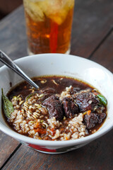 Rawon, East Java, Indonesia, captured on July 4, 2025. Traditional beef soup with rich black broth made from keluak nuts, served with rice, bean sprouts, and salted egg for a bold and aromatic flavor.