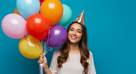 Excited young lady with a wide smile, clutching a fun assortment of bright balloons