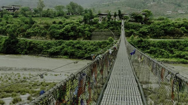 classic view of Suspension bridge crosses over the Po Chhu river in Punakha Bhutan