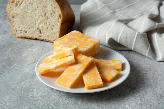 A view of slices of Colby Jack cheese, on a plate.