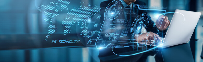 A businessman uses his laptop to analyze Information Security data, observing cyber threat growth...
