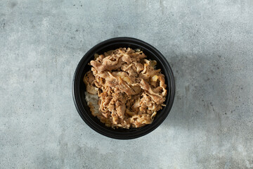 A top down view of a gyudon bowl.