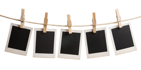 blank photo frames hanging on rope