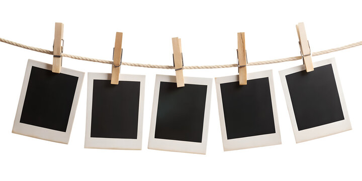 blank photo frames hanging on rope