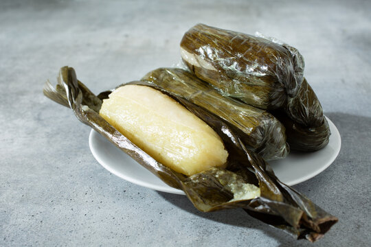 A view of some white suman pastries, on a plate.