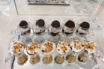 Mousse with nuts and chocolate on the buffet table.