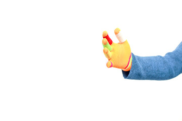 Isolated image featuring a hand wearing a colorful knitted glove against a plain white background...