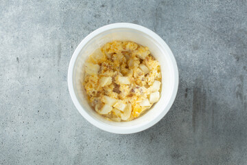 A top down view of a package cup of instant breakfast bowl.