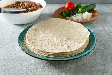 A view of a stack of gluten-free flour tortillas.