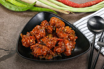 Manchurian chicken with sauce and spices