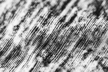 Textured Fabric: The close-up captures the subtle details of the textile, the intricate weave creating a symphony of patterns and textures.