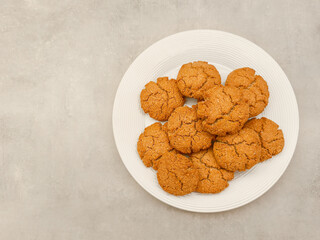 Delicious homemade ginger oat cookies on white plate