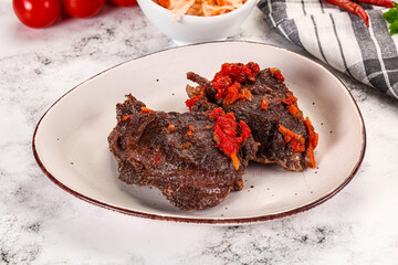 Baked beef cheeks with vegetables