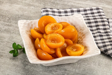 Sweet canned apricots with syrope