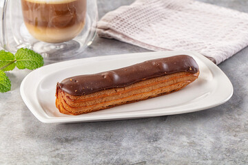 Gourmet chocolate eclair with icing