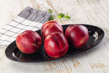 Ripe sweet juicy nectarines heap