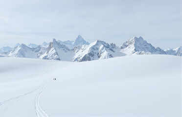 Walkers in the Snow - Covered Mountains