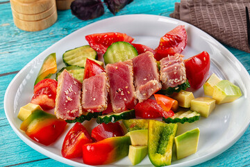 Salad with tuna tataki and avocado