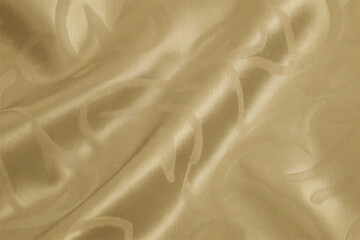 Smooth, elegant golden silk fabric with a flowing, shiny texture creates a luxurious backdrop