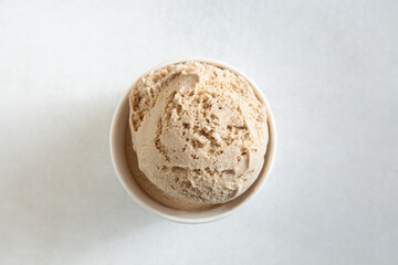 A top down view of a scoop of salted caramel ice cream.